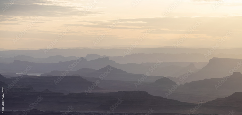 Scenic American Landscape and Red Rock Mountains in Desert Canyon. Spring Season. Canyonlands National Park. Utah, United States. Nature Background. Sunset