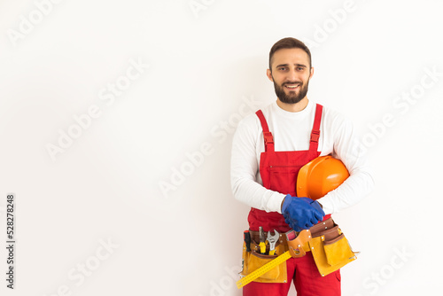 Male worker in a uniform posing isolated on white background