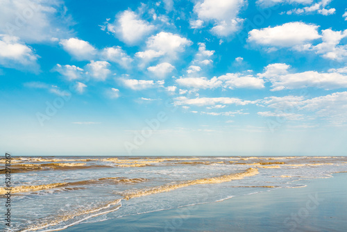 Fototapeta Naklejka Na Ścianę i Meble -  Wavy sea and blue sky with clouds