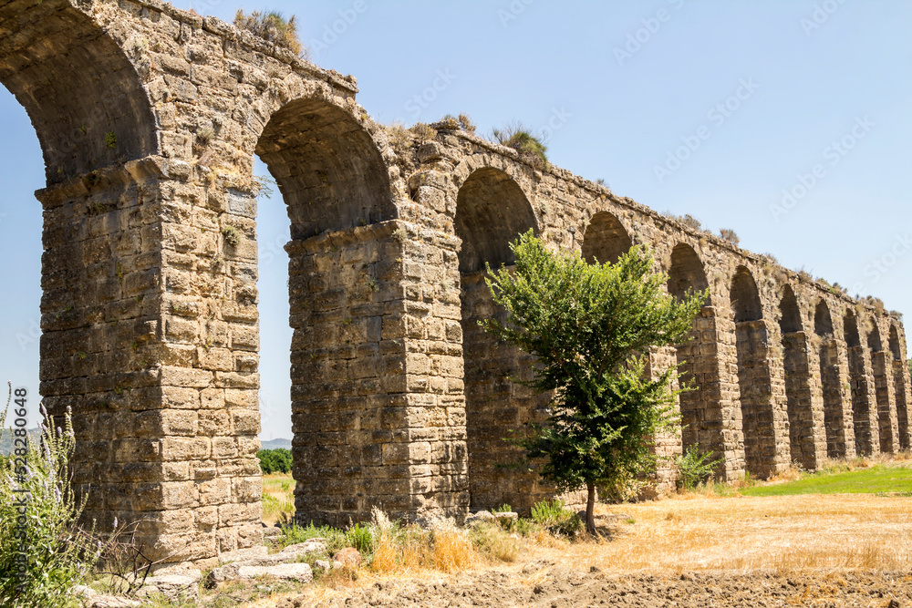 Aqueduct in Aspendos. Turkey. Ruin. An ancient Roman aqueduct that supplied Aspendos with water. Arched structure. 