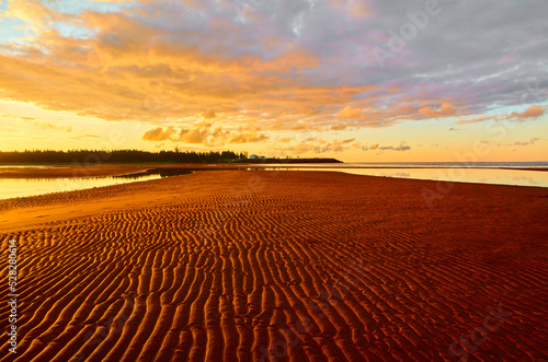 Sunrise, sea red sand Canoe Cove Prince Edward Island PEI Canada