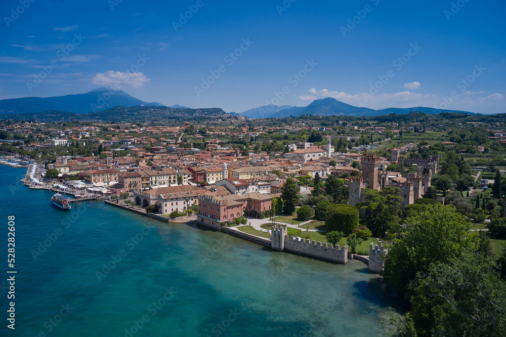 The historical part of the city of Lazise, coastline. Aerial view of Lazise city, Verona. Drone view of Lazise town on Lake Garda Italy.