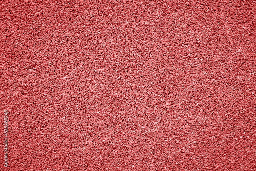 Rubber floor red texture or background. Granules playground cover texture. Rubber floor red texture or background. Granules playground cover texture.