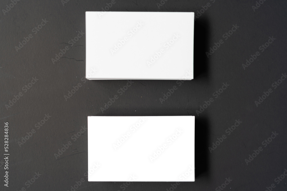 Pile of white blank space business name cards stack template for advertise and marketing on wooden texture background, clipping path for insert your banner text design for present the company brand Pile of white blank space business name cards stack template for advertise and marketing on wooden texture background, clipping path for insert your banner text design for present the company brand
