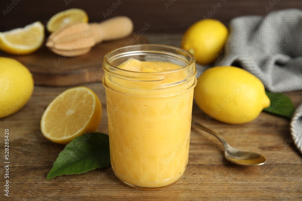 Delicious lemon curd and fresh fruits on wooden table Delicious lemon curd and fresh fruits on wooden table