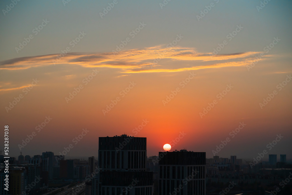 Orange sky at sunset after rain in Kazakhstan. High quality photo