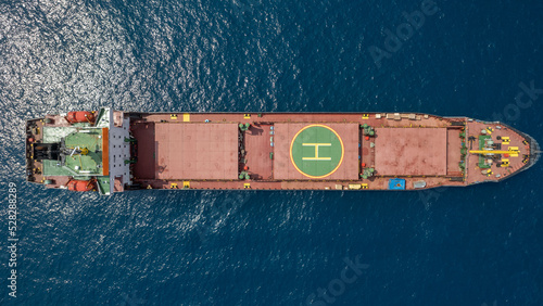Photos Large Red Cargo ship at sea with a Helipad