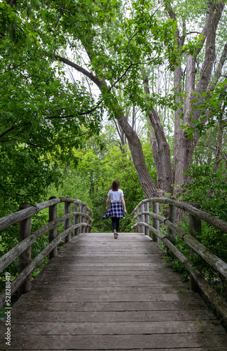 Woman alone on foot bridge
