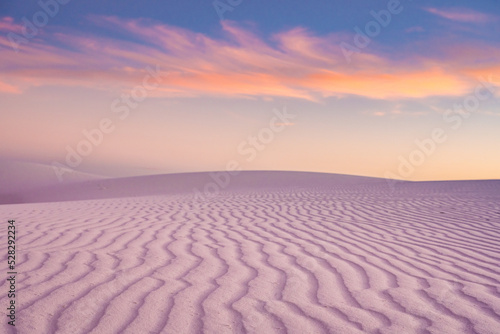 Rows of Rippling Sand Turn Pink And Orange At Sunset