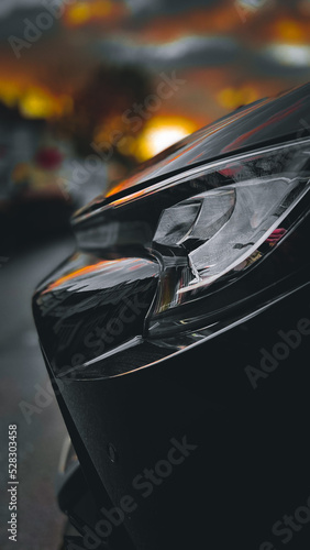 car side view in front of sunset