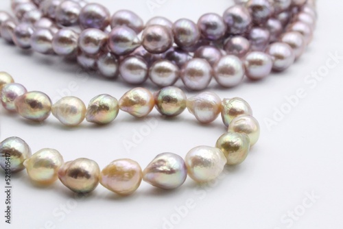 Pearl jewelry necklaces of freshwater Chinese pearls. Trendy jewellery made from beautiful shiny beads of different colors is a luxury product.