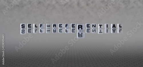 self referential word or concept represented by black and white letter cubes on a grey horizon background stretching to infinity