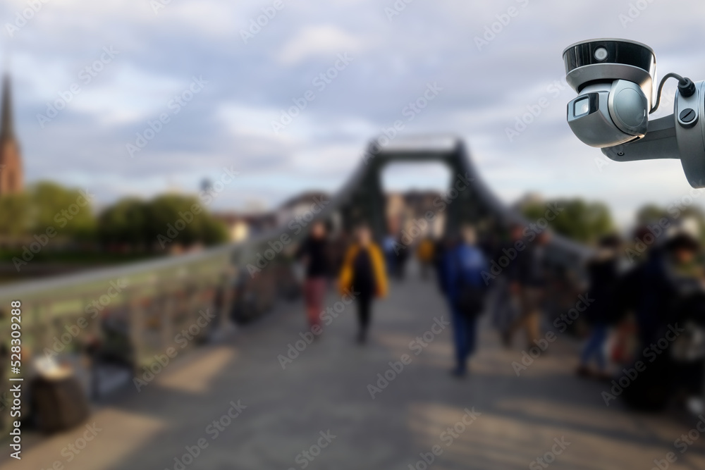 CCTV or surveillance computer operating at the bridge, walkway, street Blurred with people walking. CCTV or surveillance computer operating at the bridge, walkway, street Blurred with people walking.