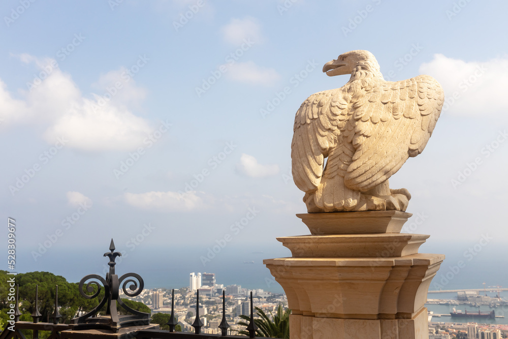 Fototapeta premium Haifa, Israel, August 12, 2022 : A decorative eagle statue is in the Bahai Garden, located on Mount Carmel in the city of Haifa, in northern Israel