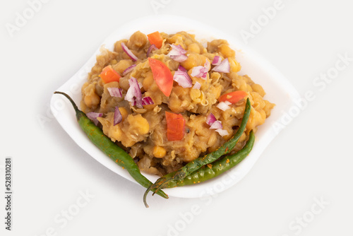 Matar Chole Also Called Chhola Or Bheeghe Chholey Is Spiced, Curry Based Savoury Food Made Of Soaked And Pressure Cooked Ahite Matar Peas Vatana Tossed With Pyaj, Tamatar, Jeera Powder, Paneer