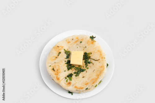 Masala Kulcha Or Kulche Is Fluffy Mildly Leavened Flatbread Made Of Knead Dough Of Maida Flour Yeast Mixed With Milk And Butter With Fresh Green Coriander Leaves And Cheese Butter Topping