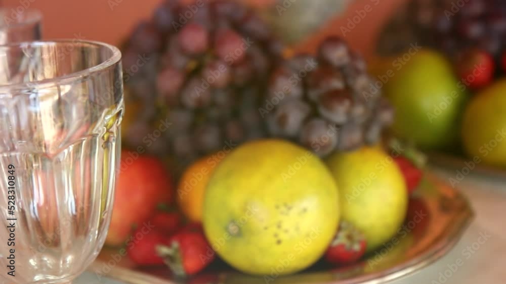 Tropical fruits. Fruits on the table. Fresh fruit, grape, orange, pineapple, strawberry. Tropical fruits. Fruits on the table. Fresh fruit, grape, orange, pineapple, strawberry.