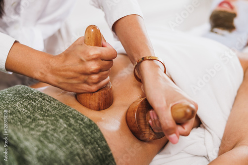 Maderotherapy Massage With Wooden Cup In A Spa Centre photo