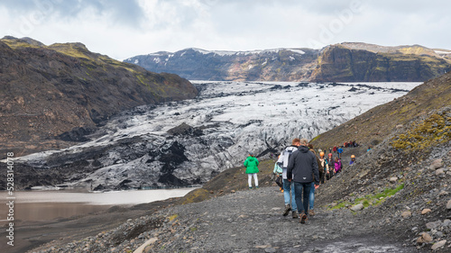 A group of hikers on the glacier in Skaftafell National Park, Eastern Iceland, Northern Europe. Solheimajokull Glacier photo