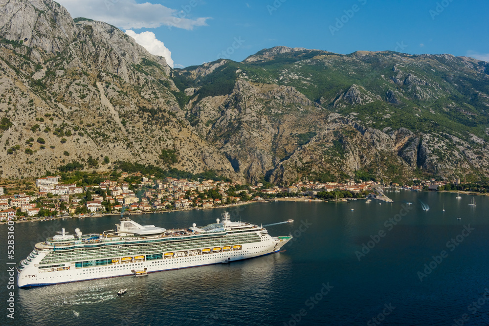 Aerial view of large cruise ship in the bay near Kotor city, Montenegro