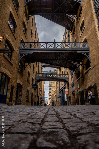 Street view of Shad Thames a historic riverside street next to Tower Bridge in Bermondsey photo