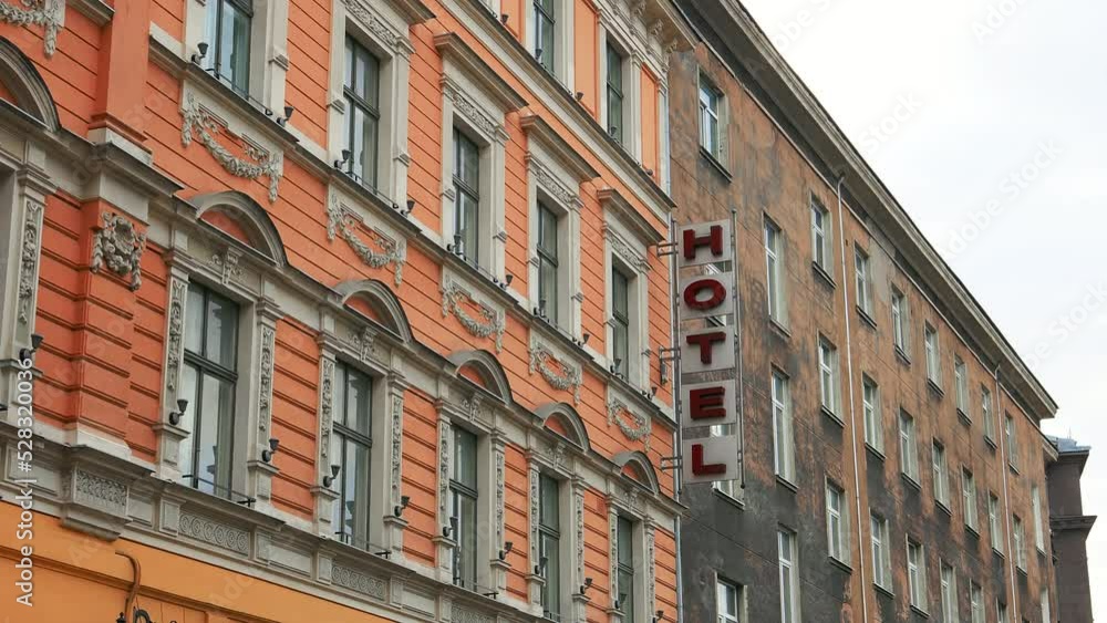 Large HOTEL sign mounted onto an old building in old city Large HOTEL sign mounted onto an old building in old city