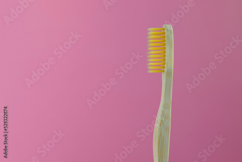 Bamboo brush on pink background  eco-friendly product