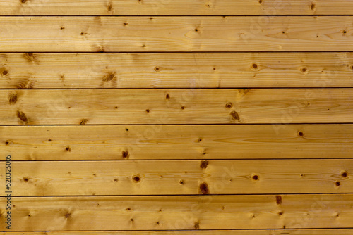 Yellow pine wood planks wall texture background flat frontal smooth planed