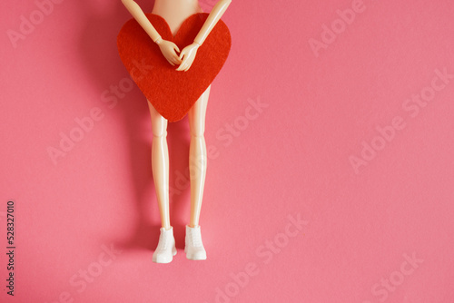 Fototapeta female doll and felt heart, woman health and love concept