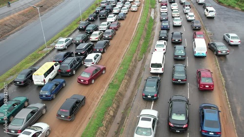 Long queuing, fuel scarcity,driver and vehicles queuing  in lagos Abuja Nigeria. This caused by Nigerian National Petroleum Company Limited (NNPC)