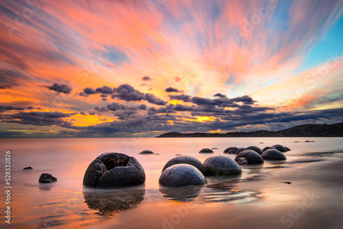 Moeraki Boulders beach at sunrise, New Zealand photo