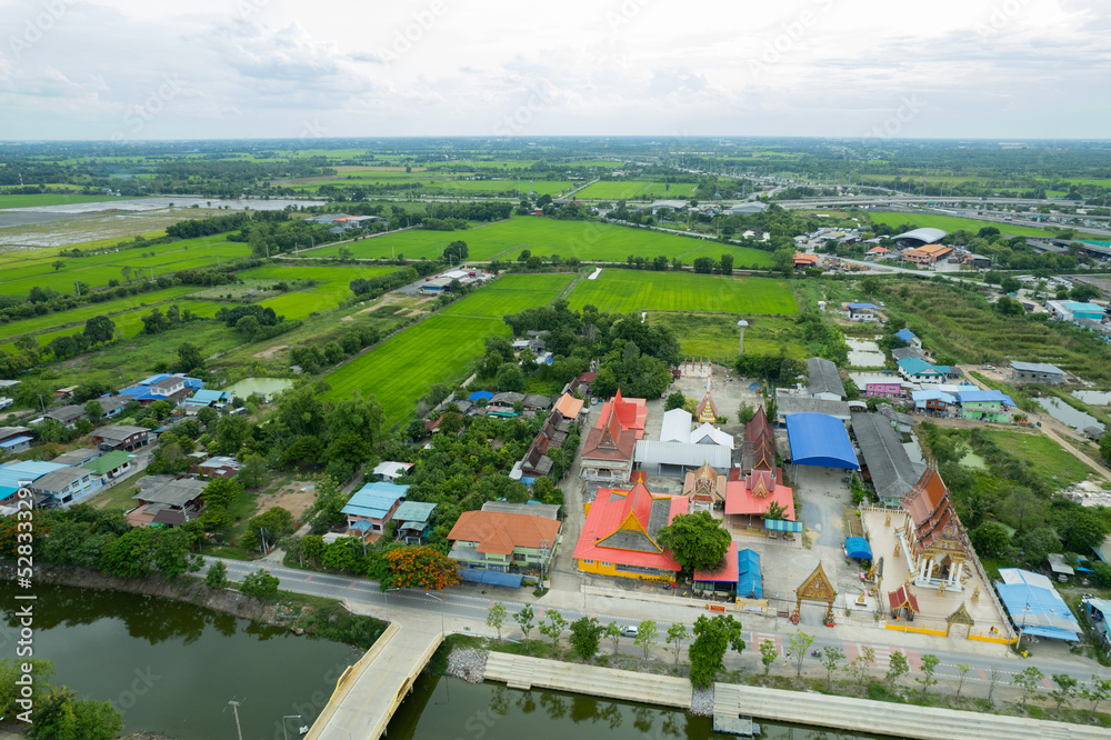 Aerial city view from flying drone at Wat Prem Prachakon ,Chiang Rak Noi, Bang Pa-in District, Phra Nakhon Si Ayutthaya,Thailand