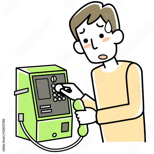 困った表で公衆電話を使っている若い男性