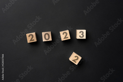 wooden cubes with 2023 new year, number change