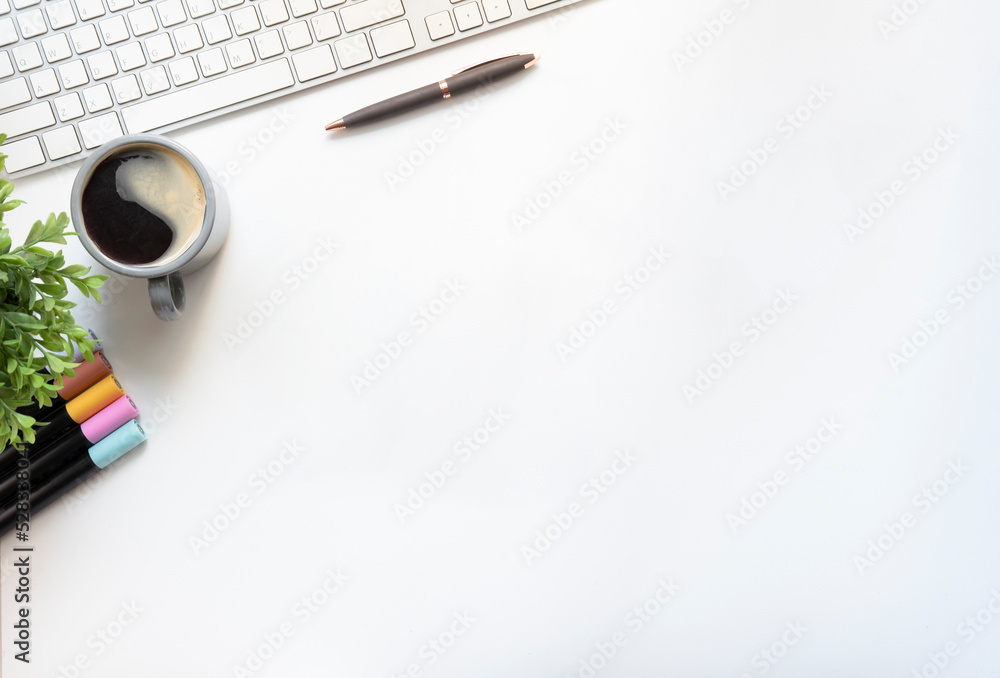 Simple workplace with notebooks, keyboard and coffee cup. Top view with copy space.. Simple workplace with notebooks, keyboard and coffee cup. Top view with copy space..
