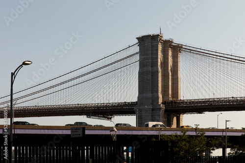 Car traffic on the FDR Drive with Brooklyn Bridge in the background. photo