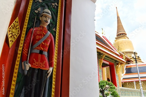 The entrance with an image of watchman in Wat Ratchabophit, The temple was built during the reign of King Chulalongkorn (Rama V). photo