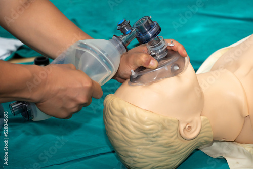 head tilt chin lift and mask for airway management in CPR training course at simulation room: soft focus