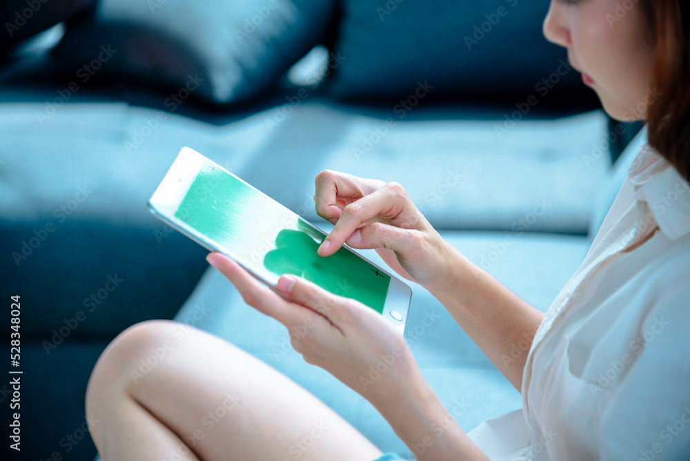 Asian woman using digital tablet shopping online, call, texting message internet technology lifestyle with smiling face. Asian woman touch smart tablet focus on hands using mobile app home office. Asian woman using digital tablet shopping online, call, texting message internet technology lifestyle with smiling face. Asian woman touch smart tablet focus on hands using mobile app home office.