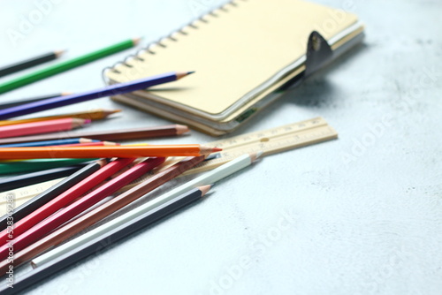 Wooden crayons scattered on the table, wooden rulers and notebooks with the festival back to the semester, students go to school, art lessons.