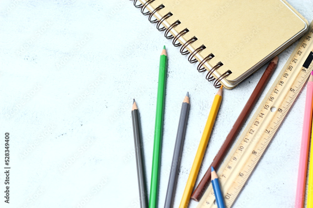 Wooden crayons scattered on the table, wooden rulers and notebooks with the festival back to the semester, students go to school, art lessons. Wooden crayons scattered on the table, wooden rulers and notebooks with the festival back to the semester, students go to school, art lessons.