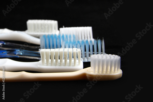 A toothbrush is an oral hygiene tool used to clean the teeth  gums  and tongue. It consists of a head of tightly clustered bristles