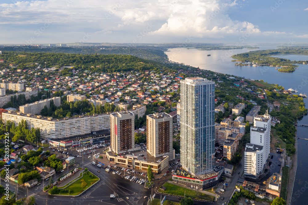 Fototapeta premium Aerial view of Saratov and Elena Skyscraper (38 floors, the tallest building in the city) on sunny day, Russia.