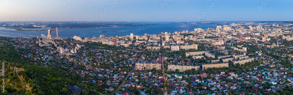 Panoramic aerial view of Saratov on morning blue hour. Saratov Oblast, Russia.