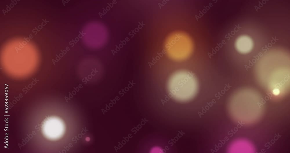 Animation of multi coloured glowing spots of light moving in hypnotic motion on background Animation of multi coloured glowing spots of light moving in hypnotic motion on background