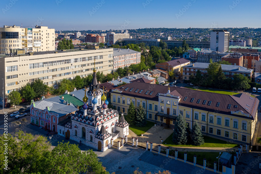 Obraz premium View of Quench My Sorrows church and Saratovskaya Eparchy building on sunny day. Saratov, Volga, Russia..