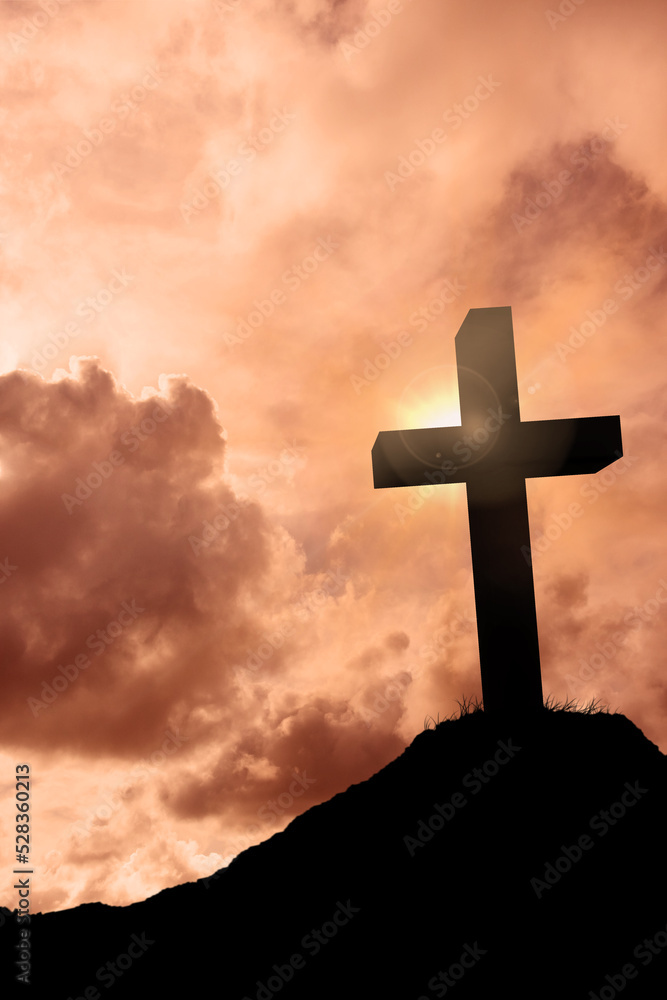 Fototapeta premium Cross religion symbol shape over sunset sky 