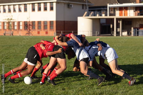 Rugby players in a scrum during a match photo