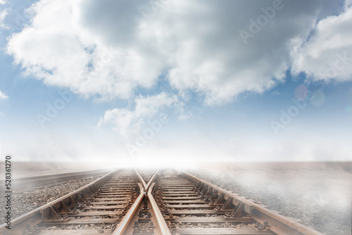 Train tracks leading over the horizon