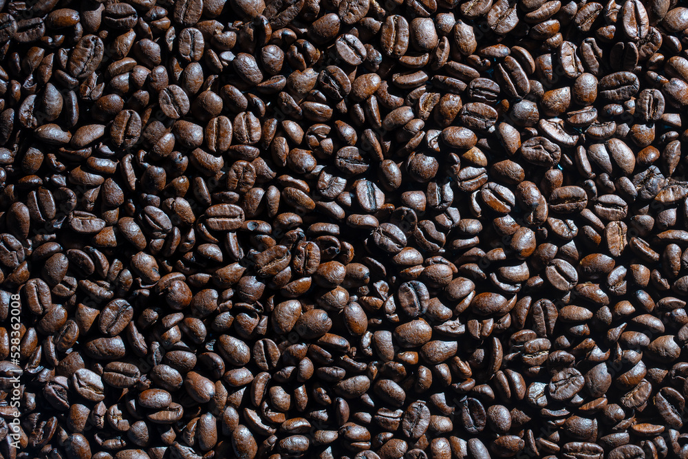 Background of fresh roasted coffee beans, close up, top view Background of fresh roasted coffee beans, close up, top view
